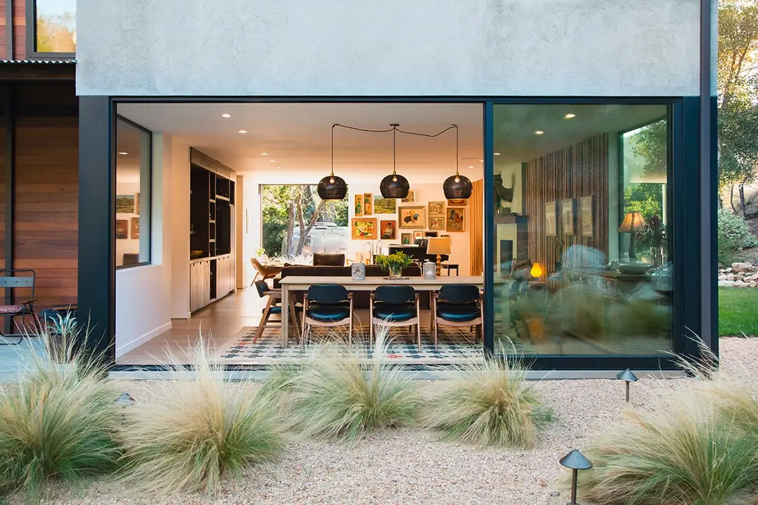 Stacking glass door system opened fully to a patio