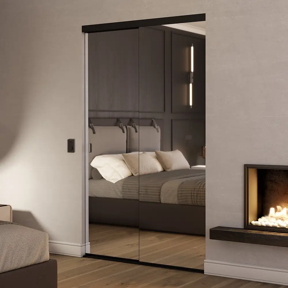 Dark framed mirrored wardrobe doors in a bedroom