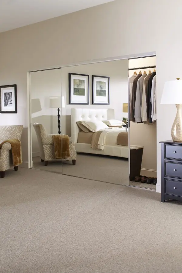 Mirrored wardrobe doors in a guest bedroom